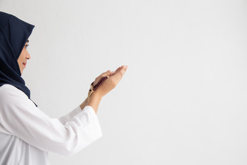 praying hands Muslim women pray to worship with faith during the Ramadan,  concept: spirituality religion for hope to create inspiration for living happiness, meditation praise god for  forgiveness