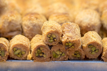 Baklava (modern Middle Eastern Arab-style dessert) baked with sugar and honey syrup, sweet and stuffed with almonds, nuts, chocolate or pistachios. In the old market, Jerusalem.