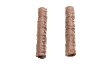 two chocolate tubules on a white isolated background