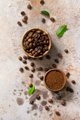 Coffee background. Coffee beans and ground powder on a stone concrete tabletop. Top view flat lay background. Copy space.
