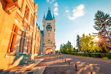 Colorful evening view of Cultural Palace Iasi. Sunny summer cityscape of Iasi town, capital of ...