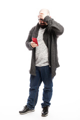 Bald man in glasses with a phone in his hands. Full height. Isolated over white background. Vertical.