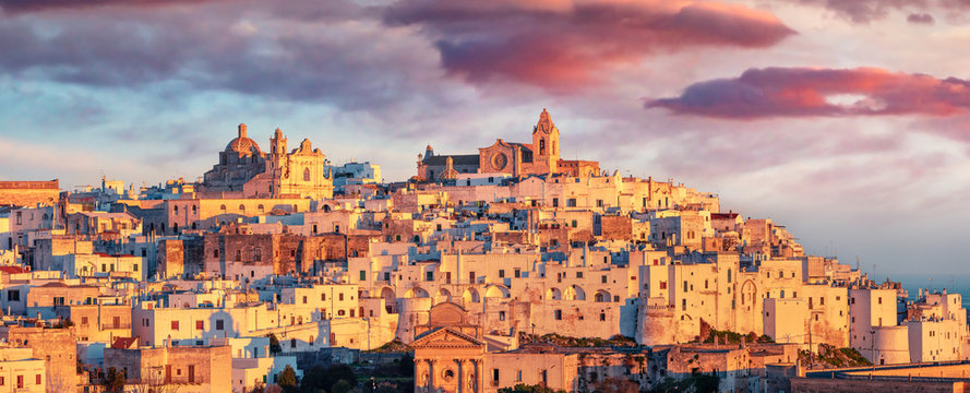 Panoramic morning cityscape of Ostuni town. Fantastic sunrise in Apulia, Italy, Europe. Traveling concept background.