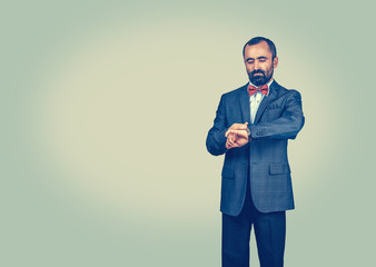 Business man looking on his watch.