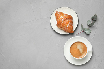 Tasty breakfast served on light grey table, flat lay. Space for text