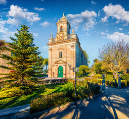 Beautiful spring cityscape of Ragusa town with San Giacomo Apostolo church. Sunny morning scene of...