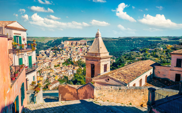 Sunny spring cityscape of Ragusa town with Church of St Mary of the Stairs on background. Wonderfulmorning scene of Sicily, Italy, Europe. Traveling concept background.