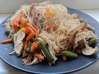 Bo bun, a Vietnamese dish made with rice vermicelli, meat, spring rolls, and salad and herbs