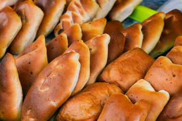 Traditional Russian baked pies close-up. Fresh mince pies.