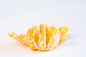 Juicy tangerine on a white background. Peeled. Disclosed