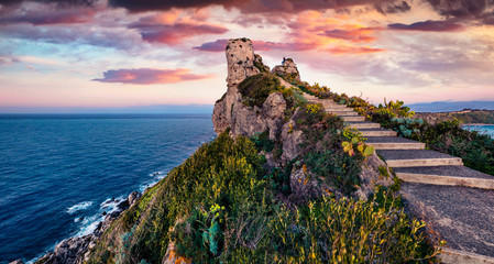 Dramatic spring view of Milazzo cape. Fantastic sunrise on Sicily, Italy, Europe. Amazing seascape of Mediterranean sea. Beauty of nature concept background.