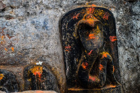Picture of dedicated temple for snake god carved on black stone