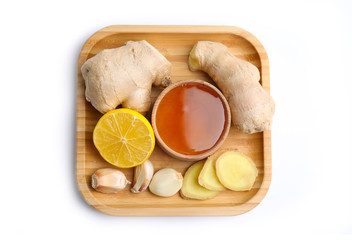 Fresh garlic and other natural cold remedies isolated on white, top view