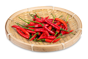red chili peppers in wooden tray on white background