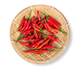 red chili peppers in wooden tray on white background