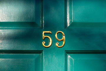 House number 59 shining in the sunlight