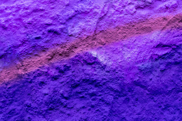 Beautiful street art graffiti background with copyspace. Abstract geometric spray drawing fashion colors on the brick wall. Urban Culture detailed close up texture purple, crimson ,blue picture