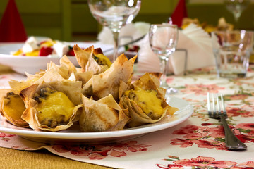Baskets puff pastry baskets filled with cheese, mushrooms and egg on plate