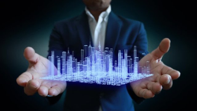 The city structure hologram in the hands business people.