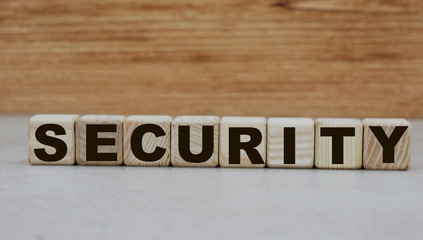 Fototapeta premium concept word safety on cubes on a wooden background