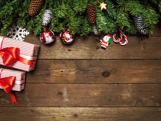 Merry christmas topic on a wooden background with christmas tree