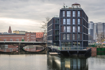 Naklejka premium Apartment house on the Oder River island in Wroclaw city, Poland