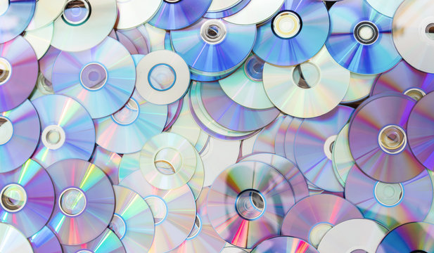 Old technology, waste compact disc collection decoration for pattern. cd background concept.