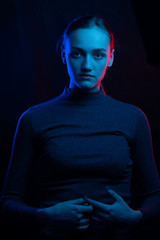 abstract fashion portrait, colored lamps girl in blue and red light