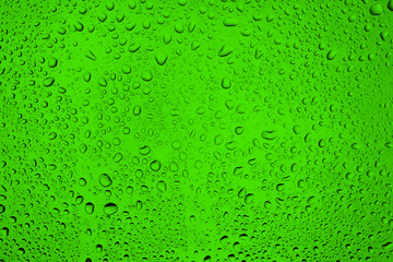 water bubbles on the glass on a beautiful green background