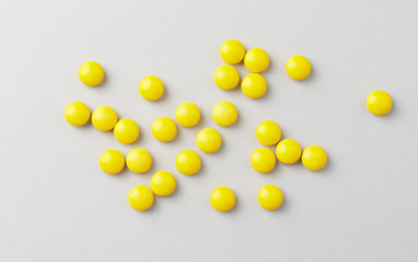 Vitamin C tablets. Bright background. Top view.