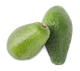 Tasty ripe avocados on white background, top view. Tropical fruit