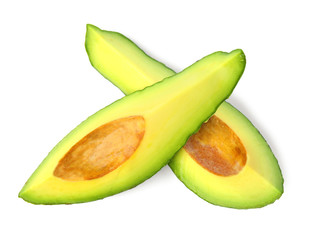 Slices of tasty ripe avocado on white background, top view