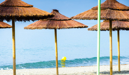parasol on sand beach in marbella spanish south of spain, sand beach and beautiful weather all year round