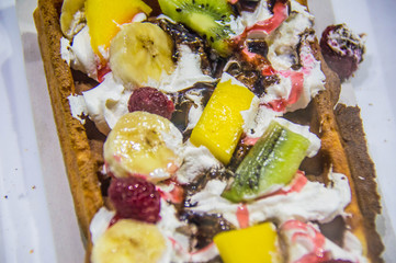 Belgian waffle with fruit and cream