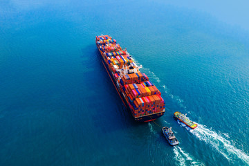 Aerial view of container cargo ship in sea.