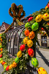 Traditionally decorated easter fountain seen in Bavaria (Germany). Easter fountain. Osterbrunnen. Traditional german easter eggs outdoor decoration. Rothenburg ob der Tauber, Bavaria - 314914110
