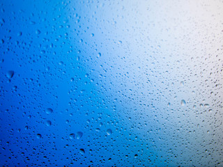 water drops on glass background.Blue water drops.