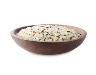Mix of brown and polished rice in wooden bowl isolated on white