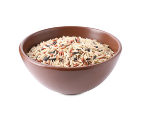 Mix of different brown rice in bowl isolated on white