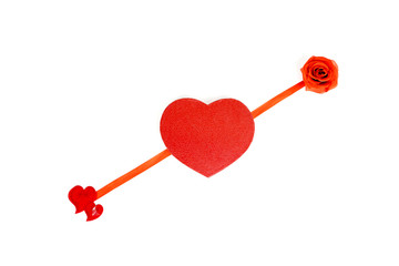 Flat lay of red love arrow with a rose at its edge