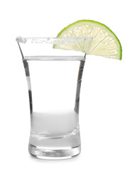 Mexican Tequila shot with salt and lime slice isolated on white