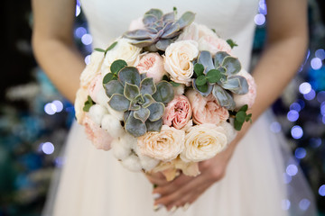 Bride with wedding bouquet, closeup