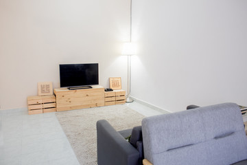 Kuala Lumpur, Malaysia - January 7, 2020 : A beautiful deco home living with sofa, tv and table coffee. Minimalist is the best choice to deco home.