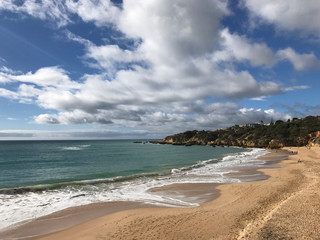 portuguese beach, rocks, high cliffs and beautiful nature and fine clean sand, atlantic ocean, vacation in europe