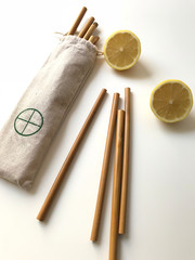 wooden straws, clean environment, fighting against the pollution of nature and seas, bamboo straws in canvas packaging for multiple use