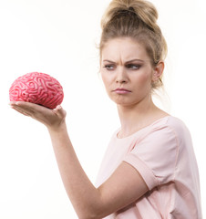 Woman holding brain having idea