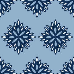 Vector Seamless Pattern of abstract floral motifs in classic blue. Simple endless pattern of cute, abstract floral elements. Use for bedding, textile, wallpaper, backgrounds, packaging and more.