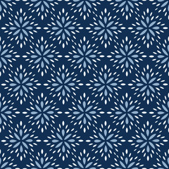 Seamless Vector Pattern of abstract flower petals in classic blue. Dense pattern of hand drawn diamond shaped floral elements in a simple, brick repeat pattern. 