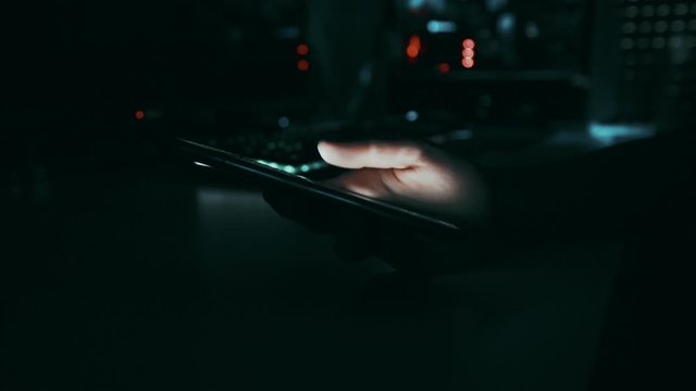Dark Sci Fi Futuristic Hand Scrolling On Big Phone Browsing Night Room  Social Cinematic Angle