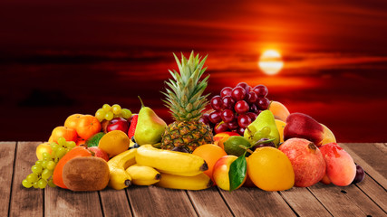 Sunset time and fresh fruits on wooden desk place